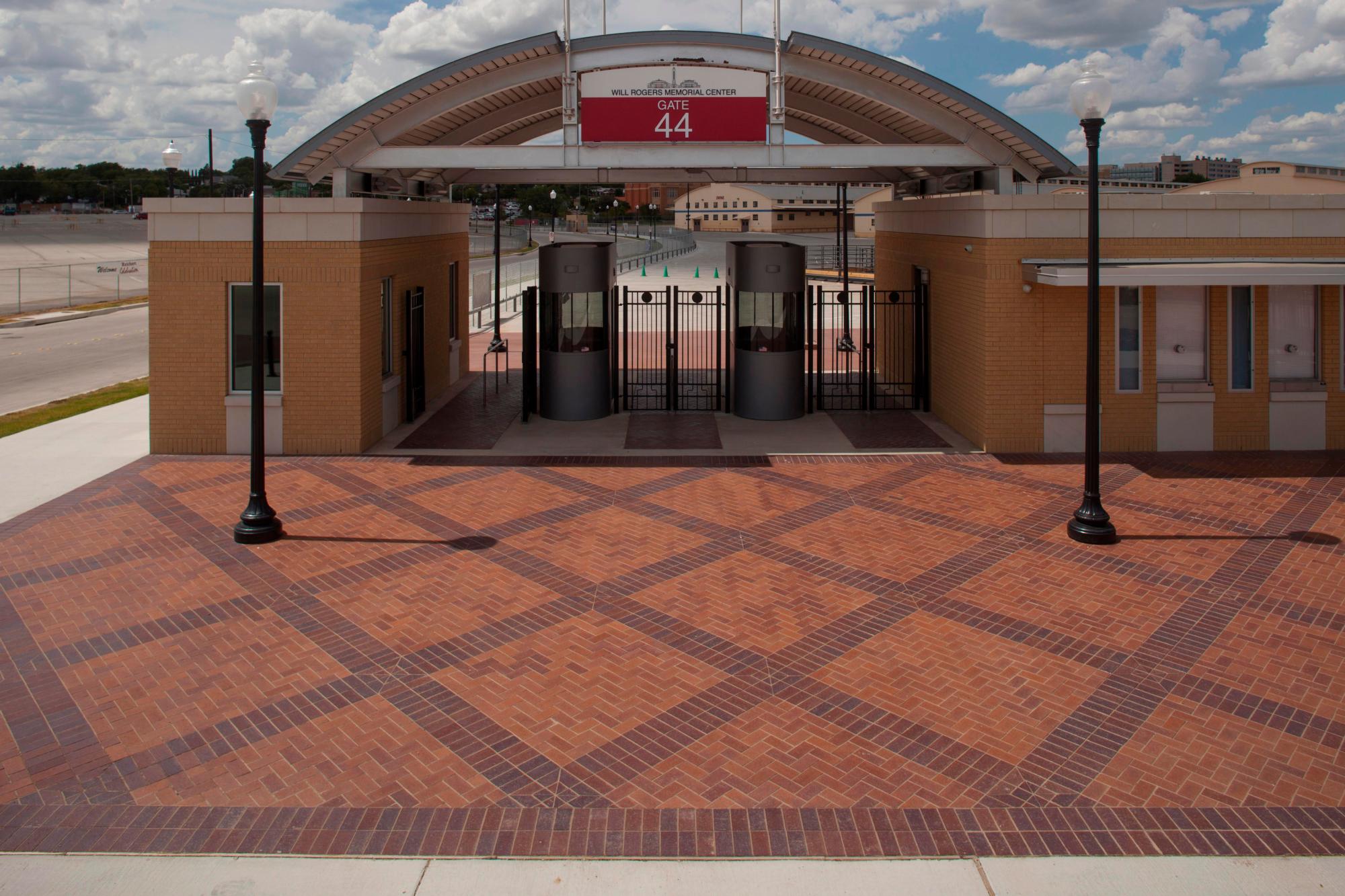Paved brick walkway of Fort Worth Cultural District Trail Drive and McWane All&eacute;e featuring light brown and dark brown bricks