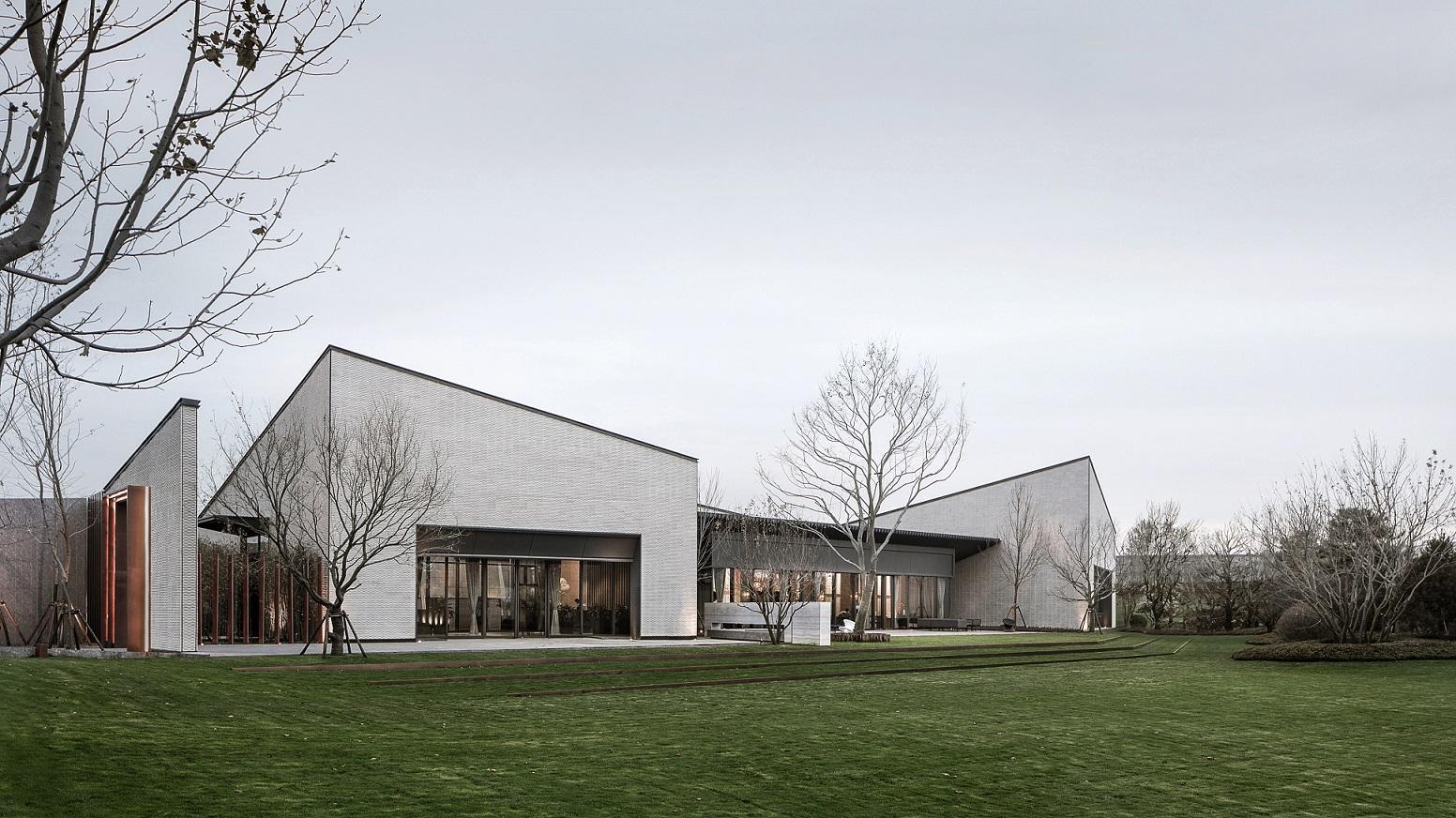 Exterior image of the white bricked Beijing Poly &middot; Sunrise Town Community Center building